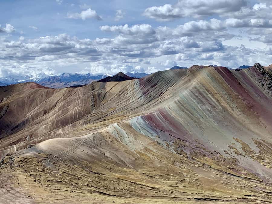 From Cusco: Full day Palcoyo Rainbow Mountain Tour - Your day in Cusco: pickup, breakfast stop, and the long van ride