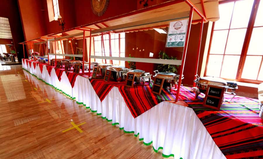 From Cusco: Sacred Valley Tour with Buffet Lunch - Chinchero murals and the weaving-centered local market