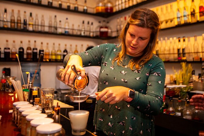 Pisco Sour Secrets: Hands-On Mixology in Historic Cusco - Making the classic: lime, syrup, egg white, and bitters